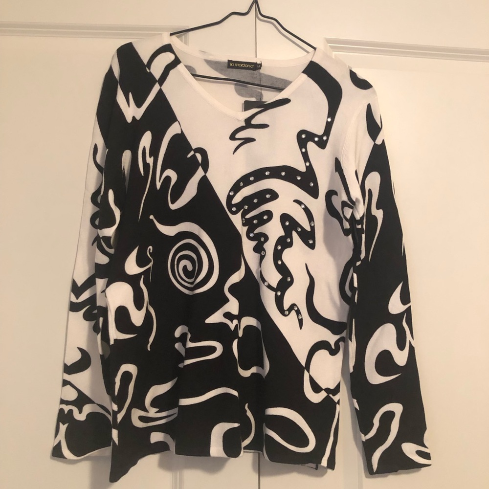 la madonna sweater with sewn on appliqué.